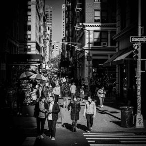 A busy city street with people walking